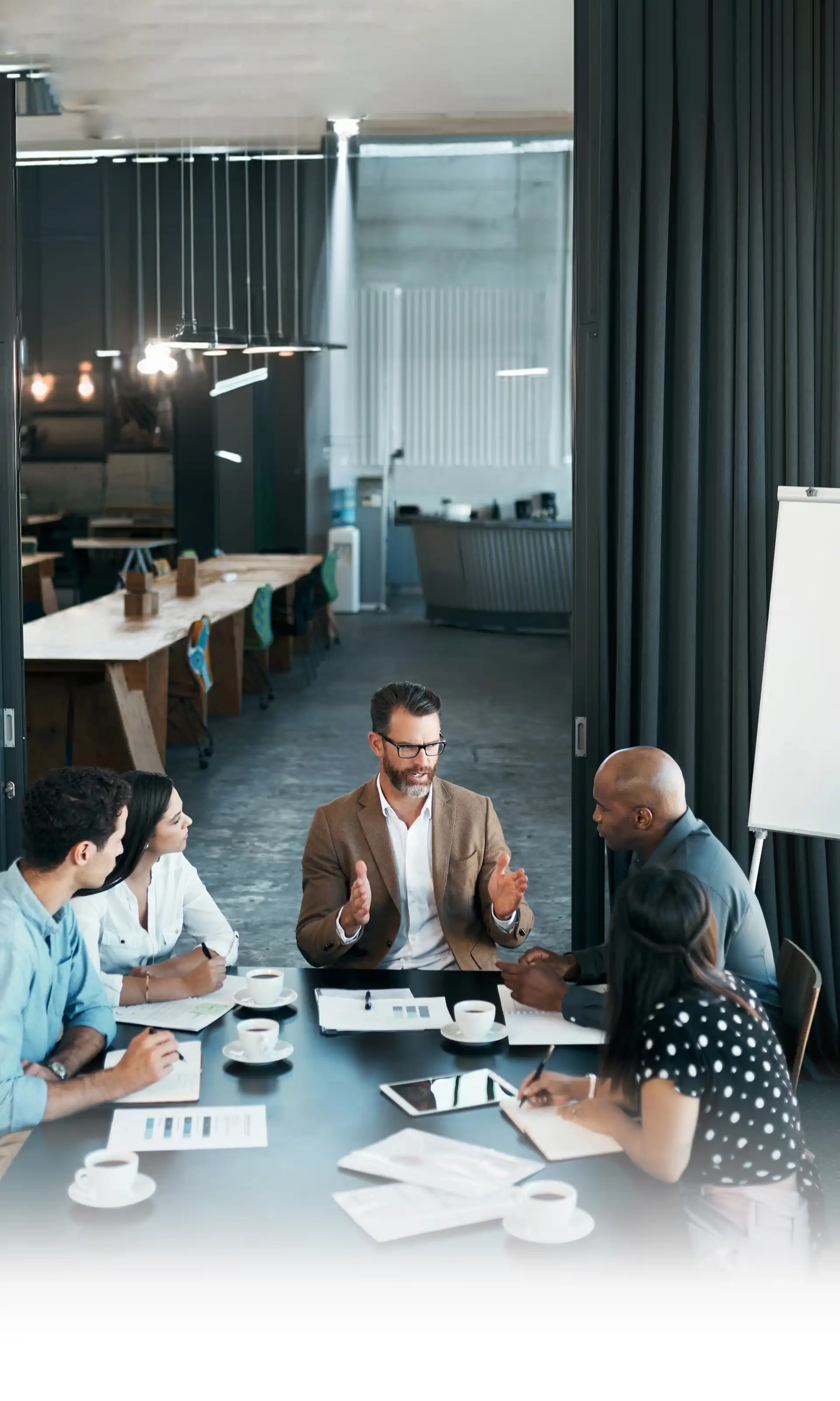 Business team in a modern office discussing strategy with a leader explain ideas, teamwork concept for consulting services.