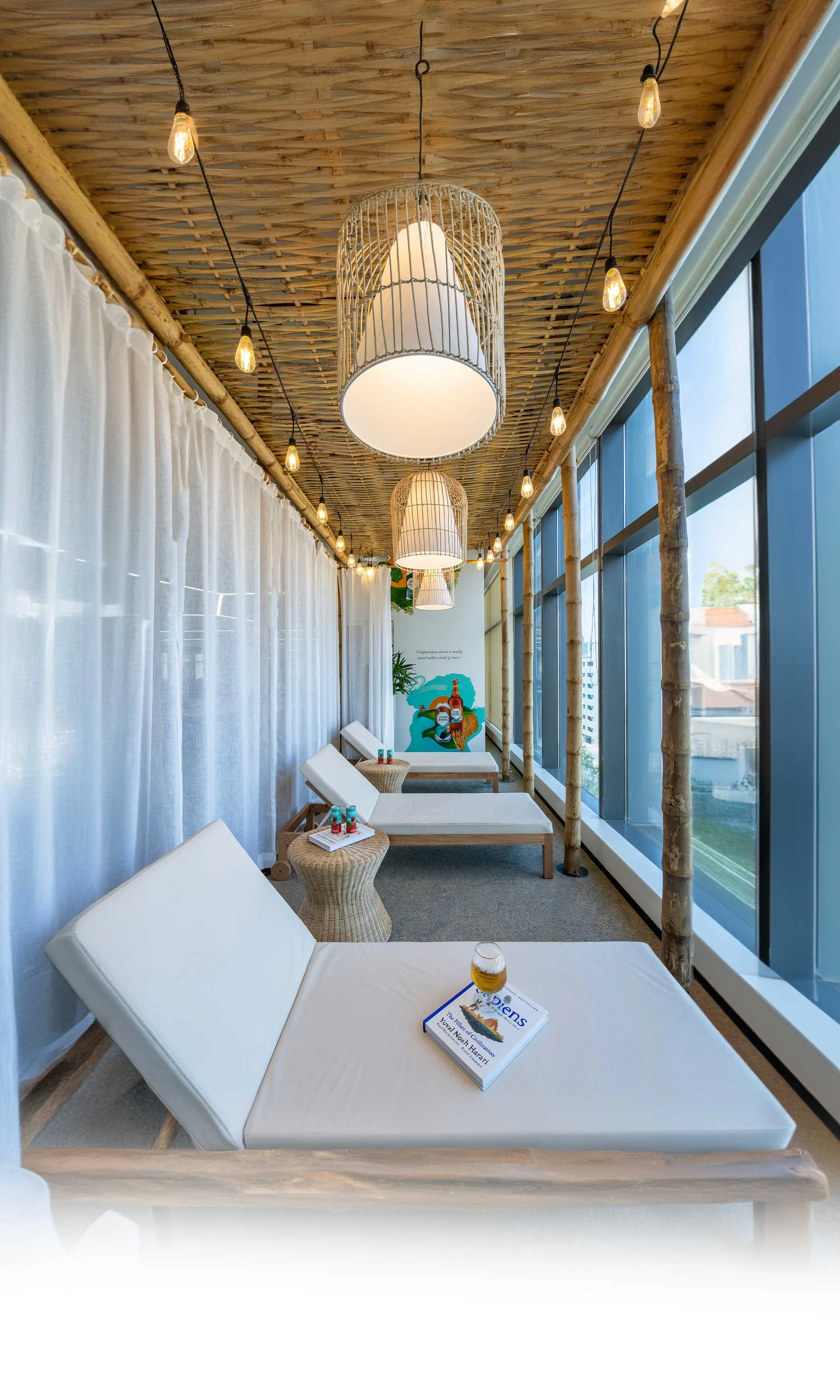 A spacious room showcasing white beds and a large window, reflecting the contemporary style of Centrix Hero Design.