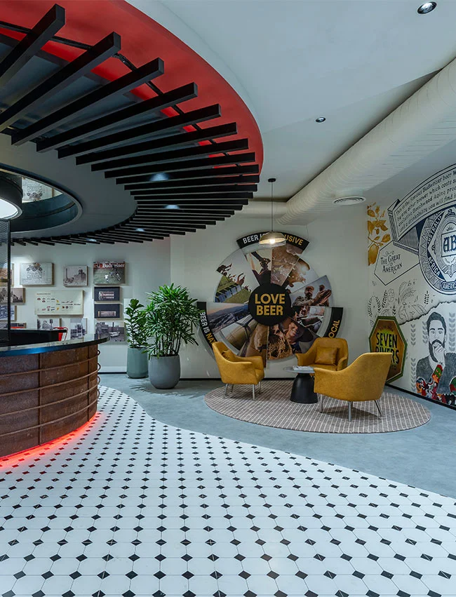 Project AB InBev: Modern office with open shelving, sleek decor, and a clean, professional atmosphere.