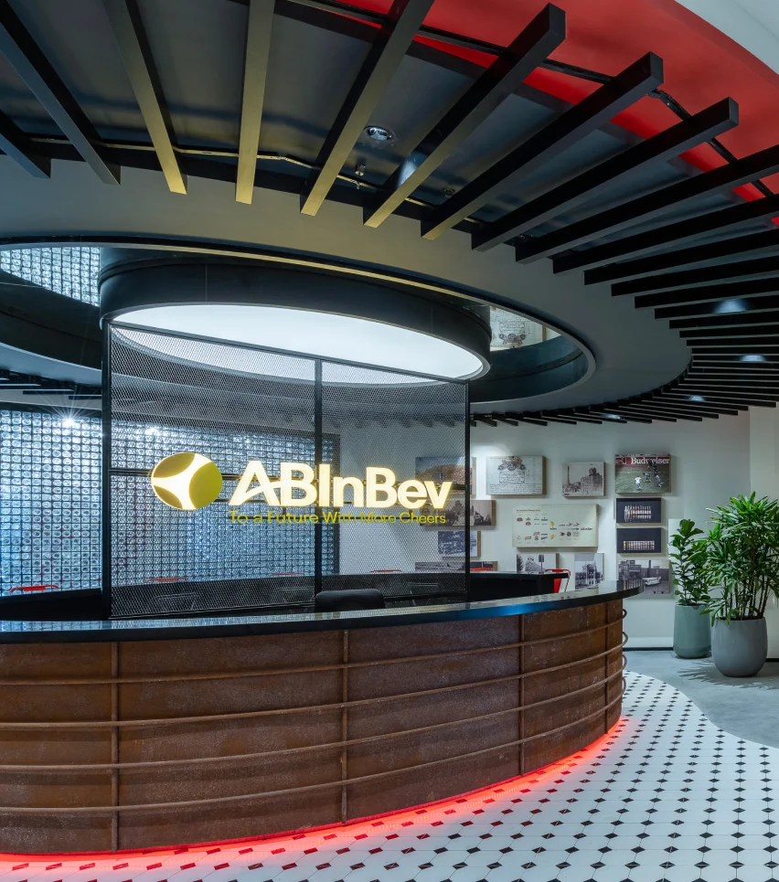 Project AB InBev: Reception area of an office building featuring a prominent red light